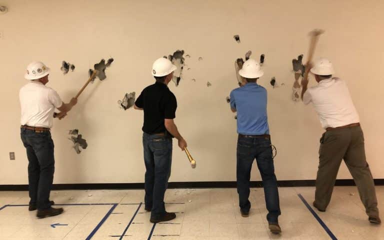 A wall-breaking ceremony takes place Tuesday at the Green Lake Mall in Spicer, launching a project to turn an unused portion of the mall into a YMCA day care center that will provide spots for 90 children in northern Kandiyohi County. The center could be open as early as Dec. 1. Carolyn Lange / Tribune