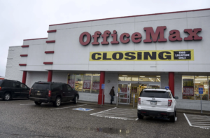 Office Max building with a 'Closing' sign out front