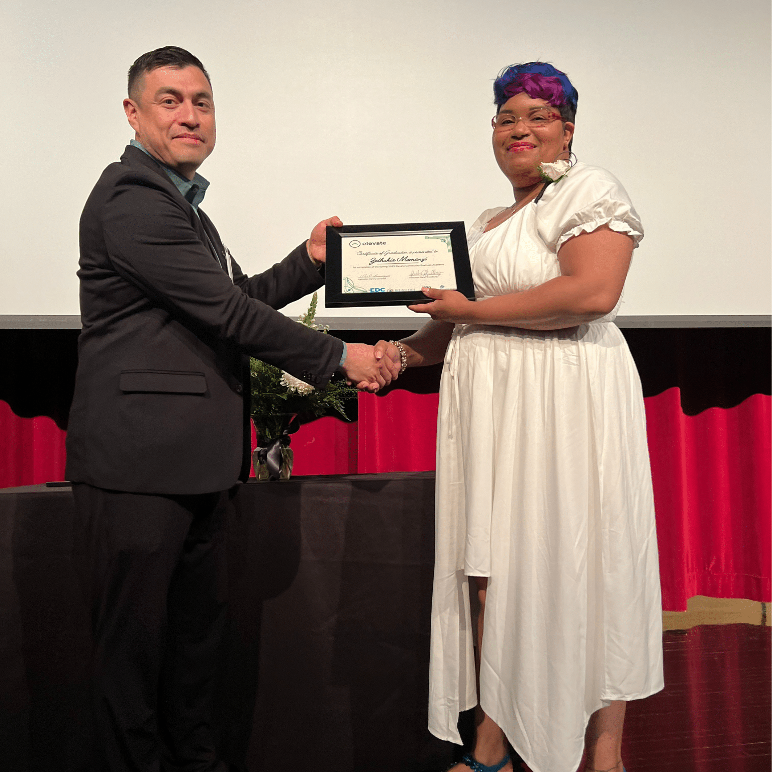 elevate participant receiving award